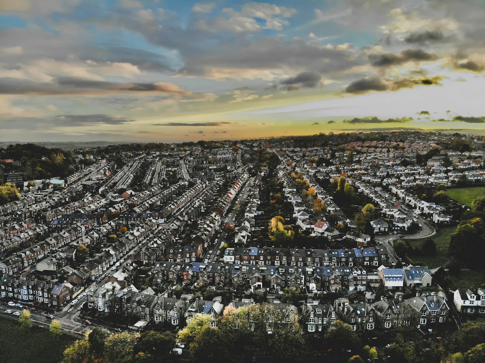 An aerial view of a housing estate meeting open fields
