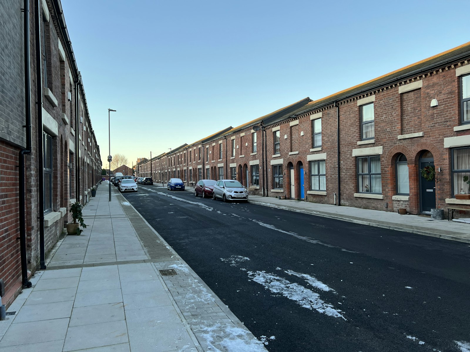 A street of red brick terraced houses